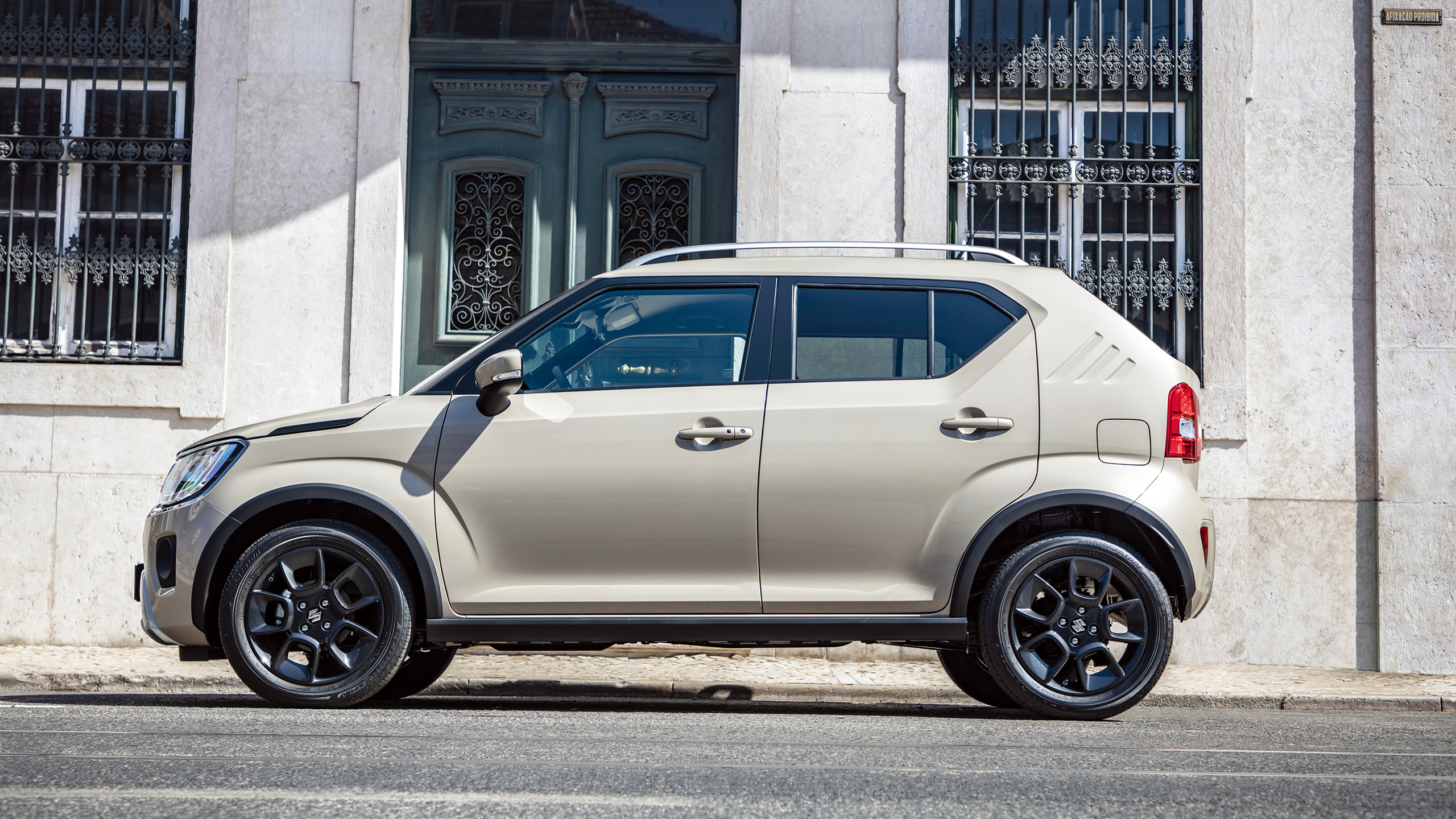 Suzuki Ignis parked in front of building